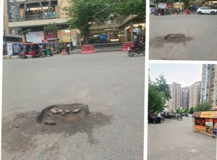 सेंट्रल मार्केट सेक्टर 119 के सामने सड़क में बना गड्ढा किस दुर्घटना का कर रहा इंतजार